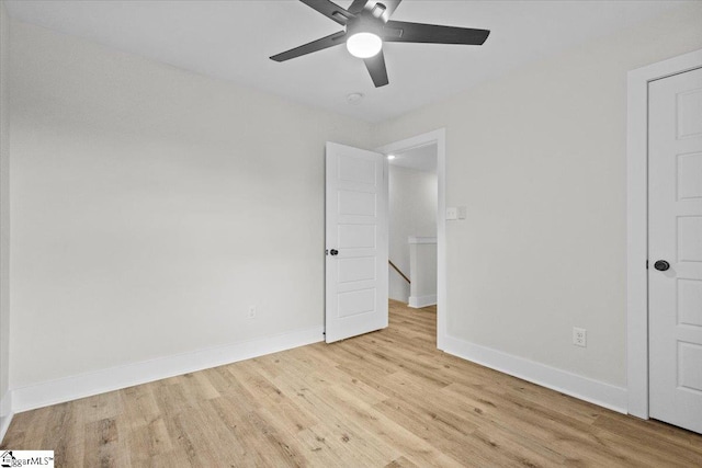 unfurnished bedroom with ceiling fan and light hardwood / wood-style flooring