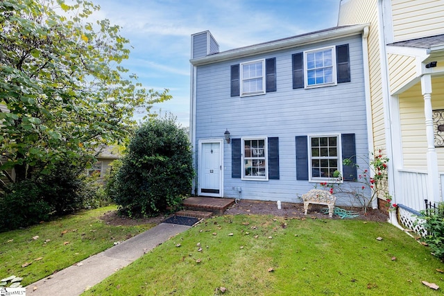 view of front of property with a front lawn