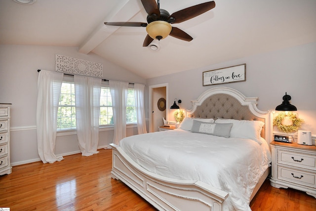 bedroom featuring ceiling fan, light wood-type flooring, and lofted ceiling with beams