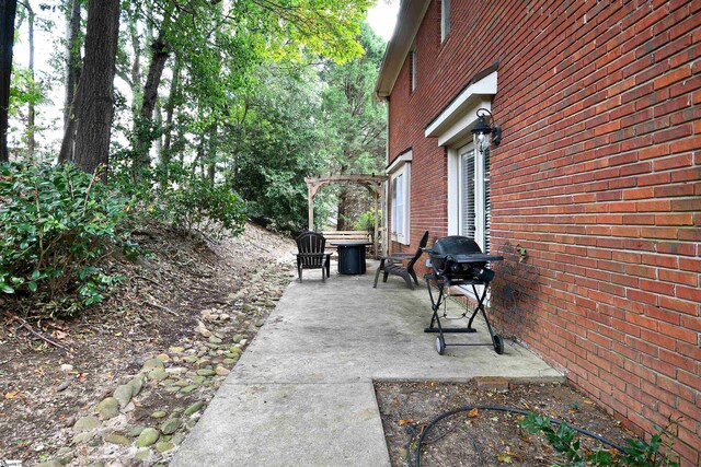 view of patio with a grill