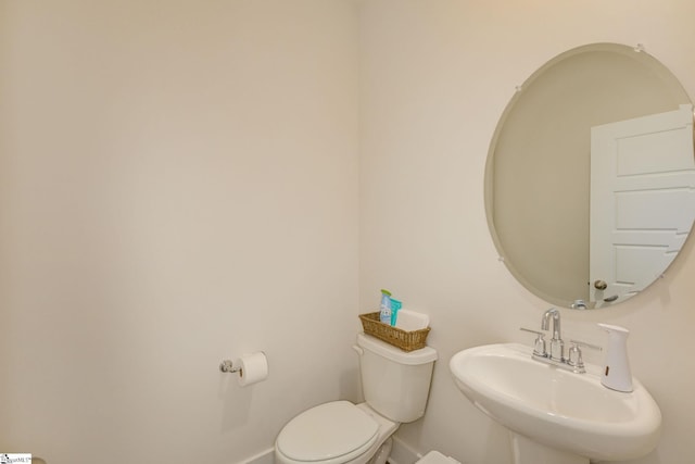 bathroom with sink and toilet