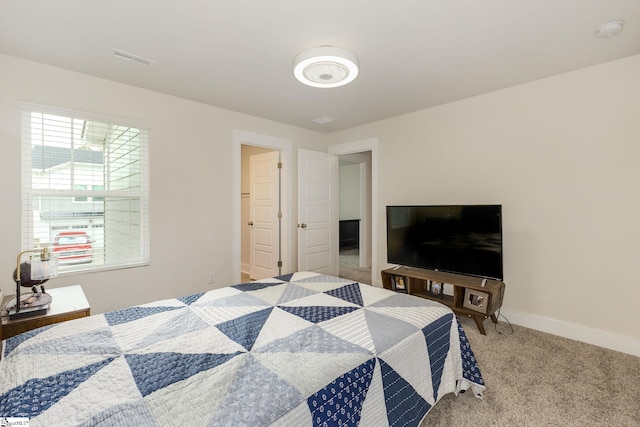 bedroom featuring light colored carpet