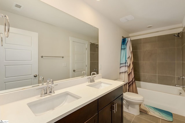 full bathroom featuring shower / bath combo, vanity, toilet, and tile patterned floors