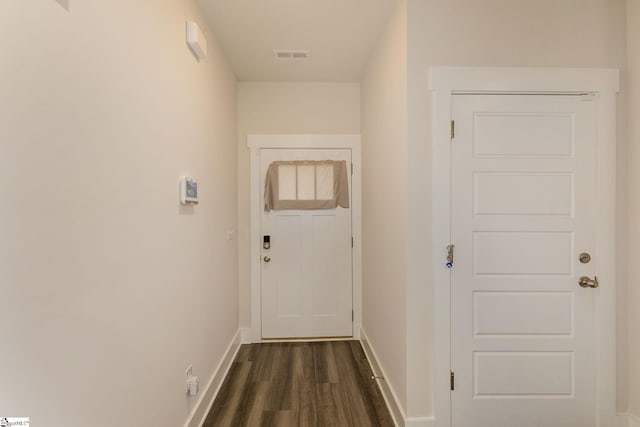 hall with dark hardwood / wood-style floors