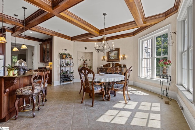 tiled dining area featuring coffered ceiling, beamed ceiling, an inviting chandelier, and crown molding