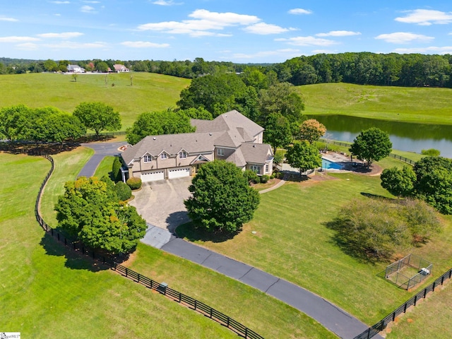 birds eye view of property with a rural view and a water view