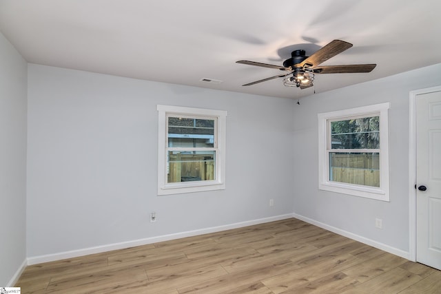 spare room with ceiling fan and light hardwood / wood-style flooring