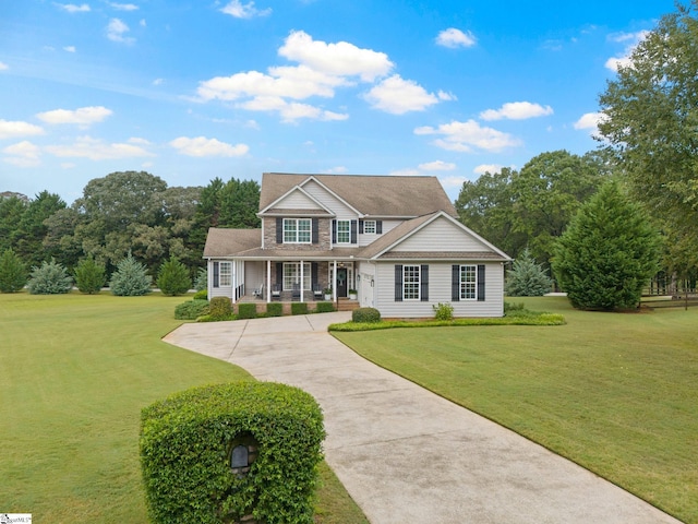 view of front facade with a front yard and a porch