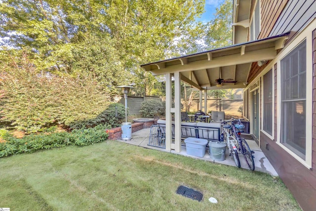 view of yard with a patio and ceiling fan