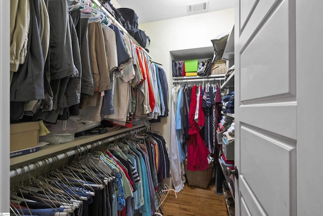 spacious closet featuring hardwood / wood-style floors