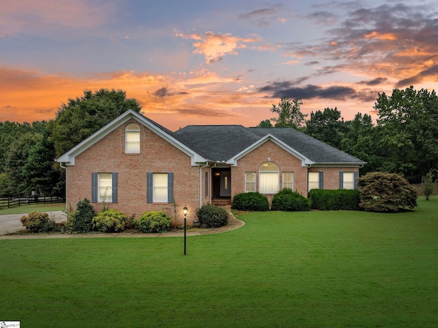 ranch-style house with a yard