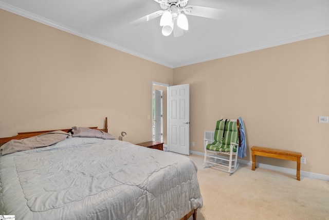 bedroom featuring baseboards, ornamental molding, light carpet, and a ceiling fan