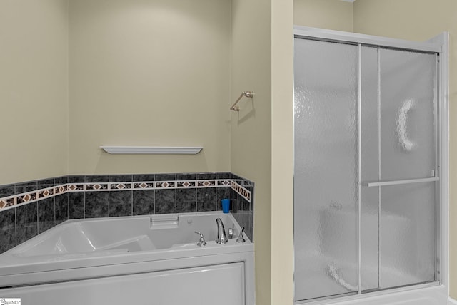 full bath with a garden tub and a stall shower