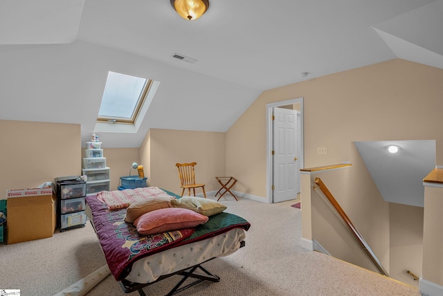 living area featuring visible vents, carpet, lofted ceiling with skylight, and an upstairs landing