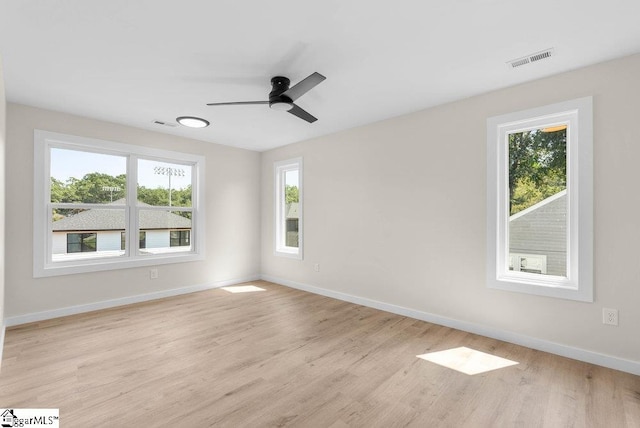 unfurnished room featuring ceiling fan and light wood-type flooring