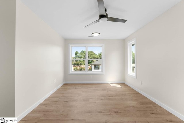 empty room featuring light wood-type flooring and ceiling fan