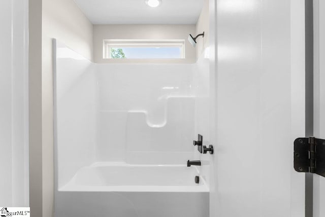 bathroom with shower / tub combination