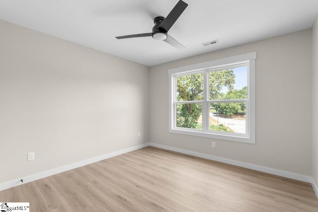 unfurnished room with ceiling fan and light hardwood / wood-style flooring