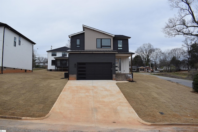123 Jackson St, Greer, SC 29650 - contemporary home with board and batten siding, an attached garage, concrete driveway, metal roof, and a standing seam roof