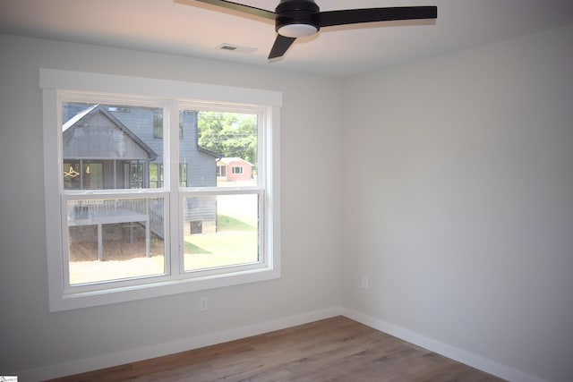 123 Jackson St, Greer, SC 29650 - spare room featuring ceiling fan, wood finished floors, and baseboards