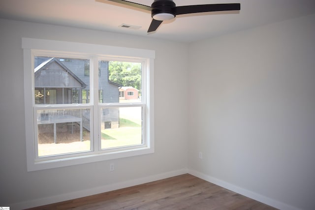 empty room featuring ceiling fan and hardwood / wood-style flooring