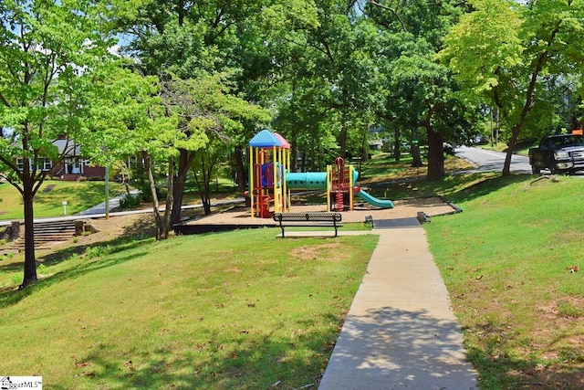 view of playground with a yard