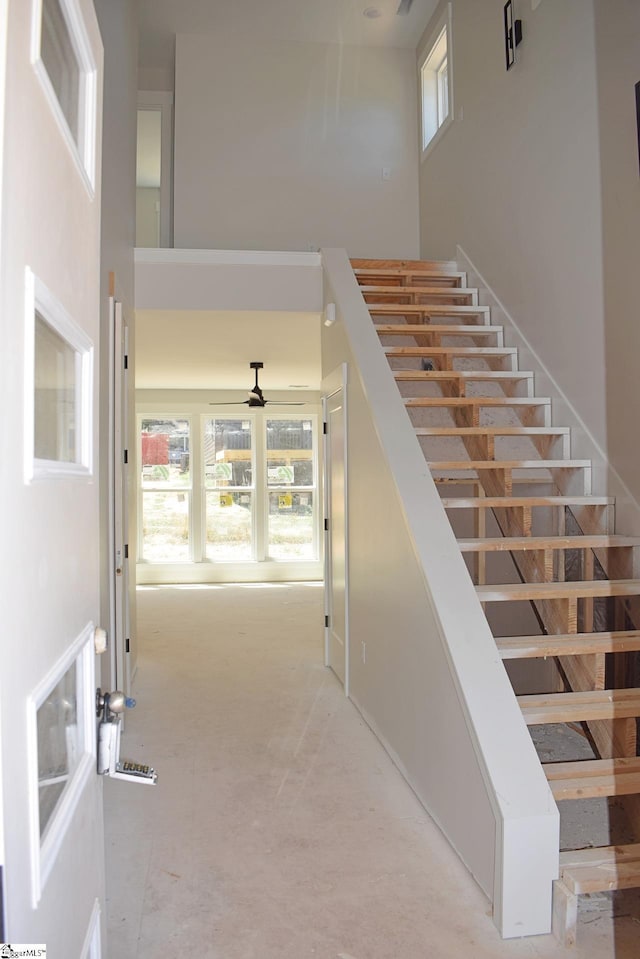 123 Jackson St, Greer, SC 29650 - stairway with a high ceiling, plenty of natural light, and ceiling fan
