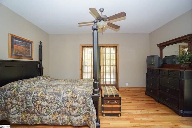 bedroom with ceiling fan and light hardwood / wood-style flooring