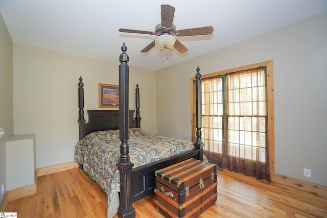 bedroom featuring ceiling fan and light hardwood / wood-style flooring