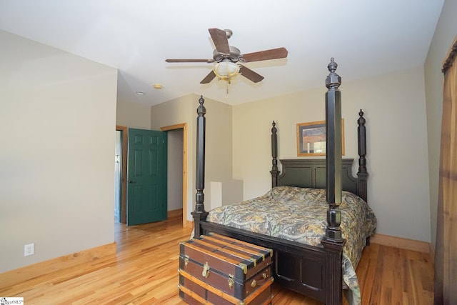 bedroom with wood-type flooring and ceiling fan