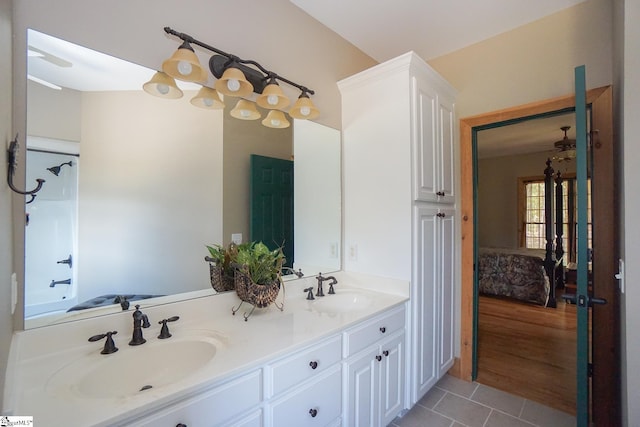 bathroom featuring tile patterned flooring and vanity