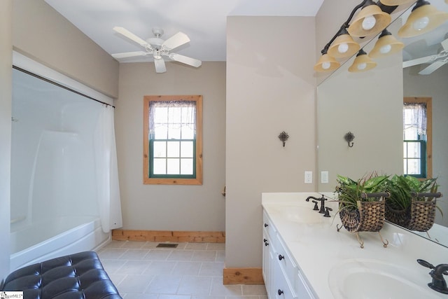 bathroom featuring shower / tub combo with curtain, vanity, ceiling fan, and tile patterned floors