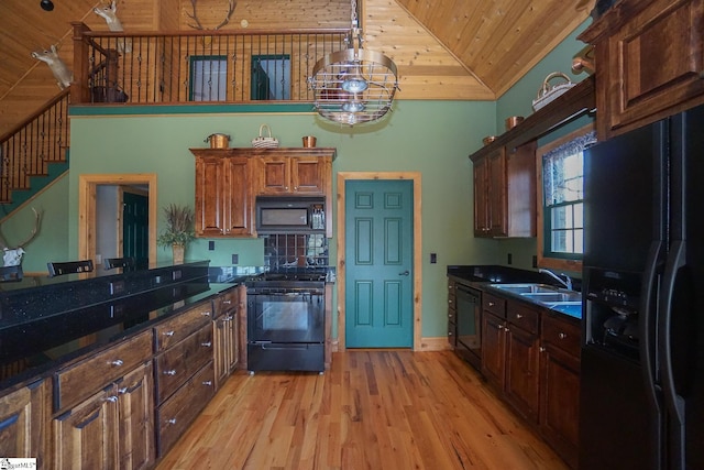 kitchen featuring light hardwood / wood-style floors, sink, an inviting chandelier, black appliances, and wooden ceiling