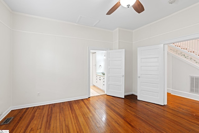 unfurnished bedroom featuring ornamental molding, ceiling fan, and hardwood / wood-style floors