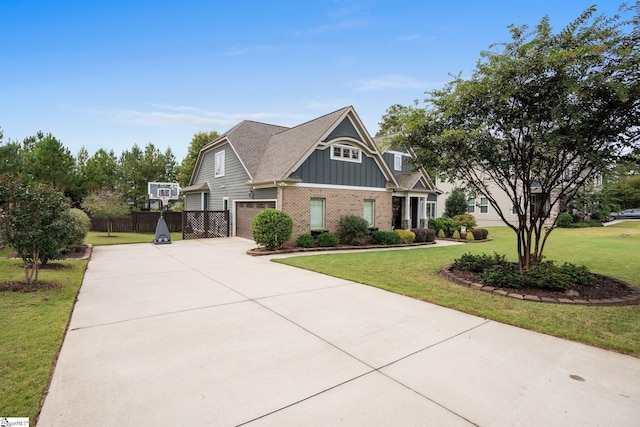 craftsman house featuring a garage and a front yard