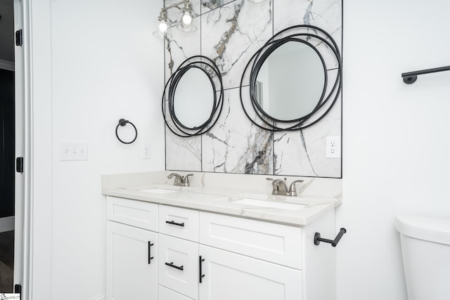 bathroom featuring backsplash, vanity, and toilet