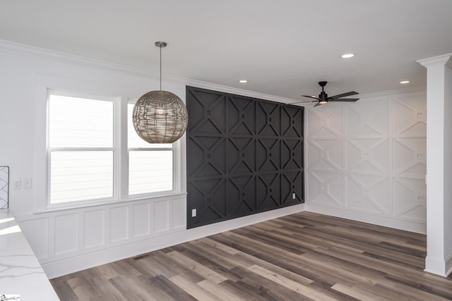 empty room featuring crown molding and dark hardwood / wood-style flooring