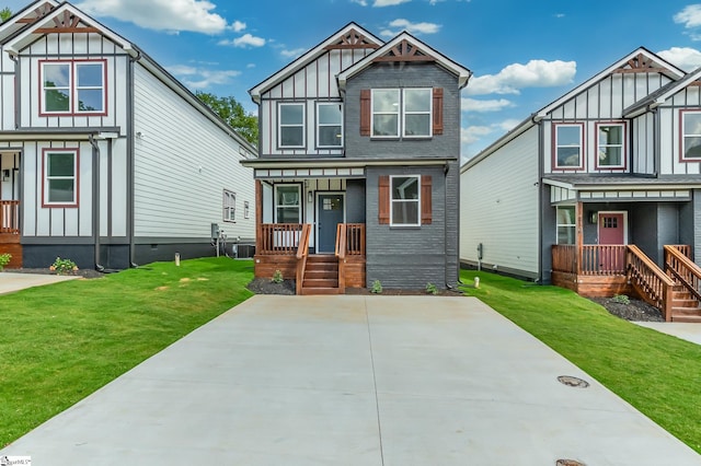 view of front facade featuring a front lawn, covered porch, and central air condition unit