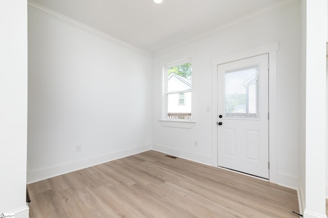 entryway featuring light hardwood / wood-style floors and crown molding