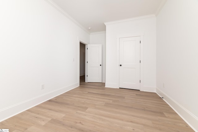 unfurnished bedroom featuring ornamental molding and light wood-type flooring