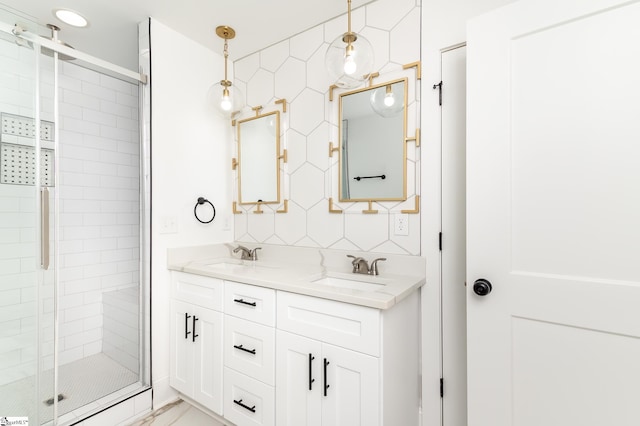 bathroom with walk in shower, vanity, and backsplash