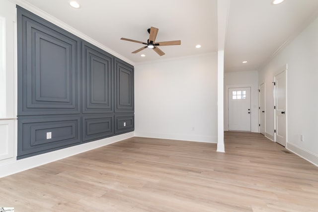 interior space with ceiling fan, light hardwood / wood-style flooring, and crown molding