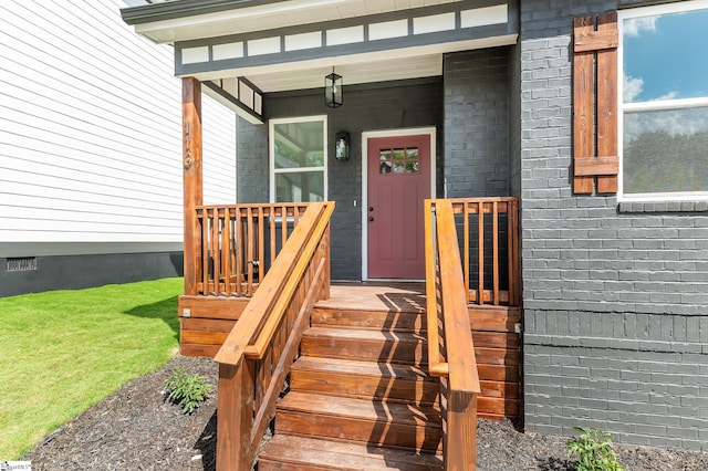 doorway to property with crawl space and brick siding