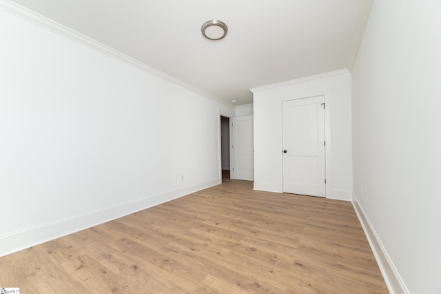 unfurnished bedroom with light hardwood / wood-style flooring and crown molding