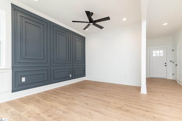 interior space with ceiling fan, light hardwood / wood-style flooring, and ornamental molding