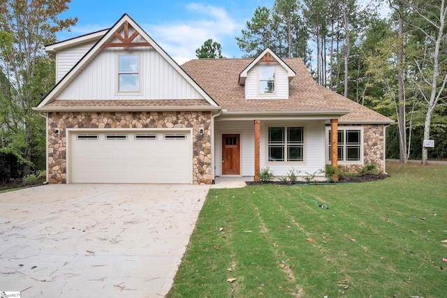 view of front of house with a garage and a front yard