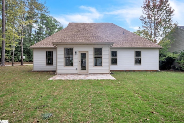 back of house with a patio and a yard