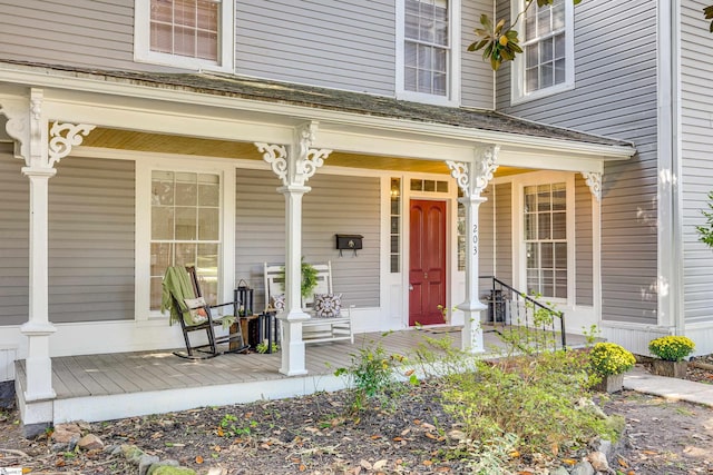 doorway to property featuring a porch