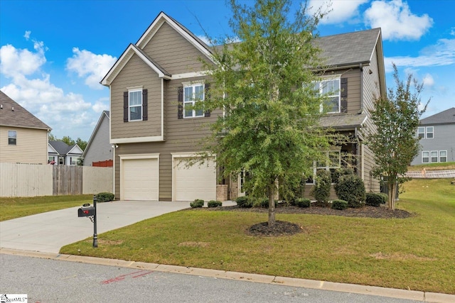 view of front of house with a front lawn and a garage