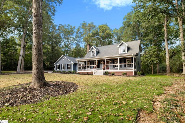 view of front facade with a front yard and a porch